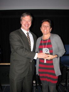Brett St. Clair presents Good as Granite Award to Robin Schell.